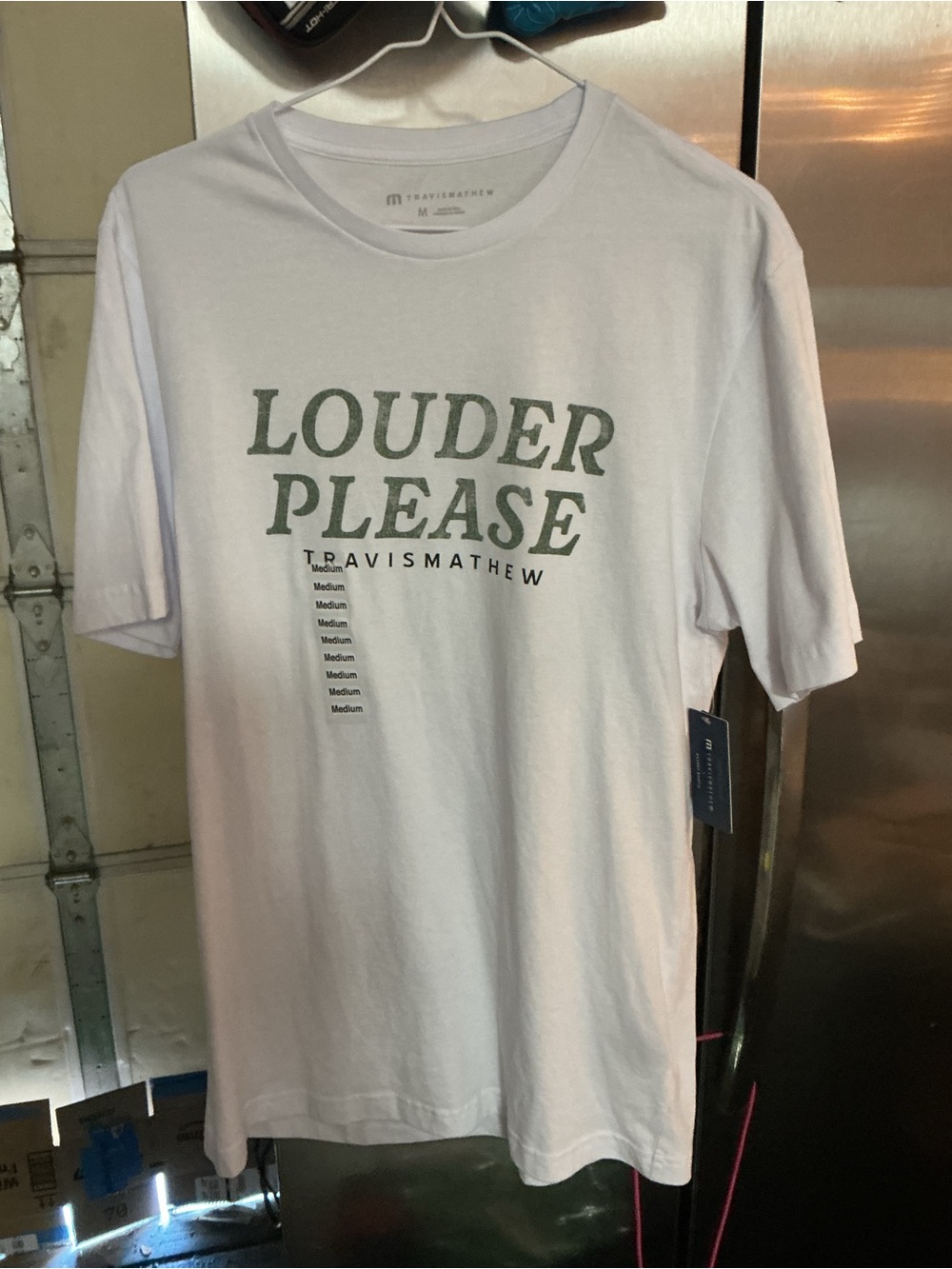 Travis Mathew White Tee with Olive Green "Louder Please" Graphic